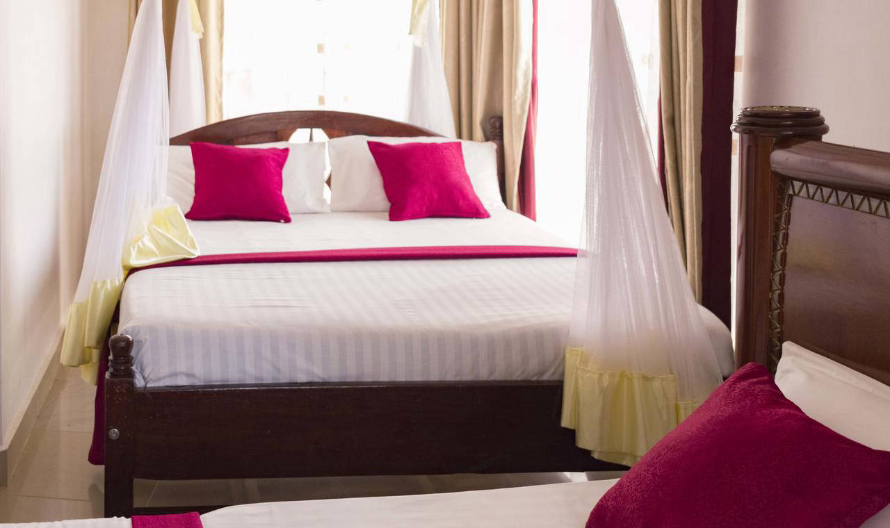 Standard Room bed at Sienna Beach Hotel
